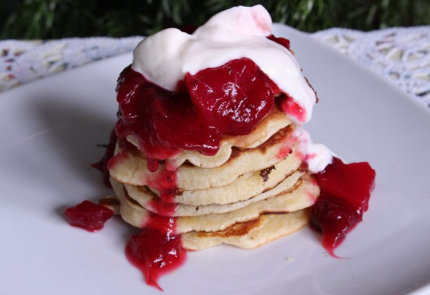 Orange and cinnamon pancakes, with pear and cranberry compote